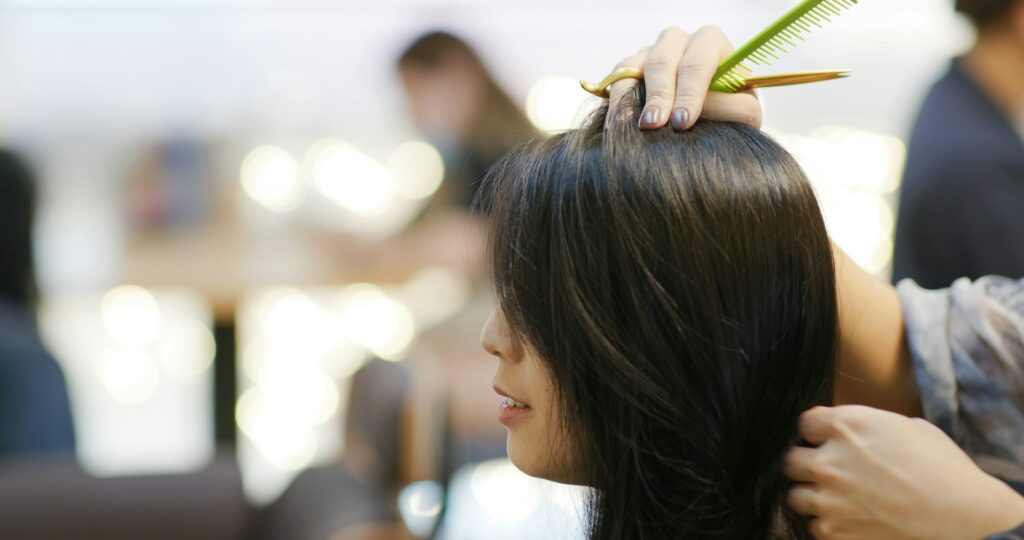 Woman with hair cut at salon