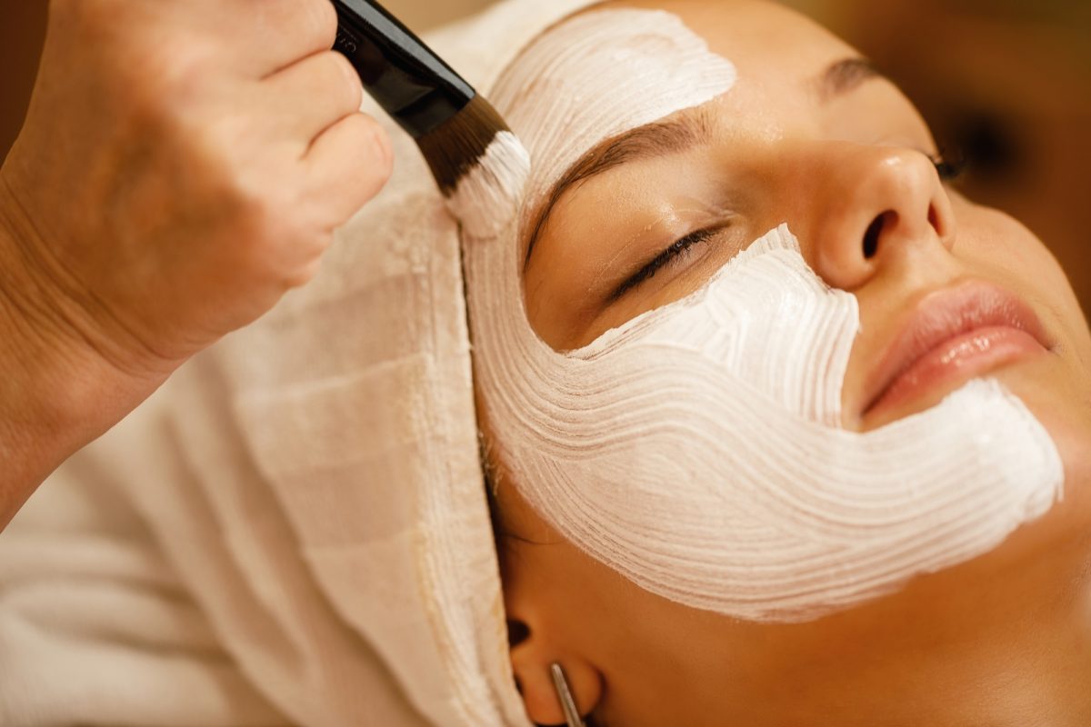 Close-up of facial treatment with detox mask.