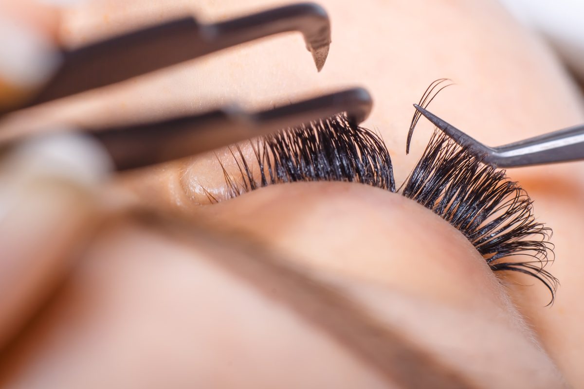 Eyelash Extension Procedure. Woman Eye with Long Eyelashes. Lashes, close up, macro, selective focus